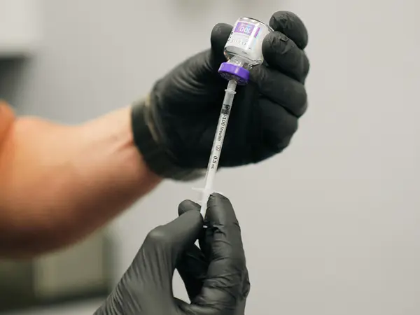 Licensed medical provider at Refresh Vero Beach preparing an injectable treatment using manufacturer-verified product.